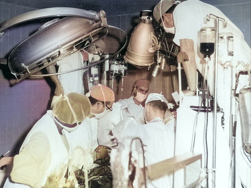 On Jan. 23, 1964, the Hardy transplant team goes to work on heart recipient Boyd Rush in this colorized photo.